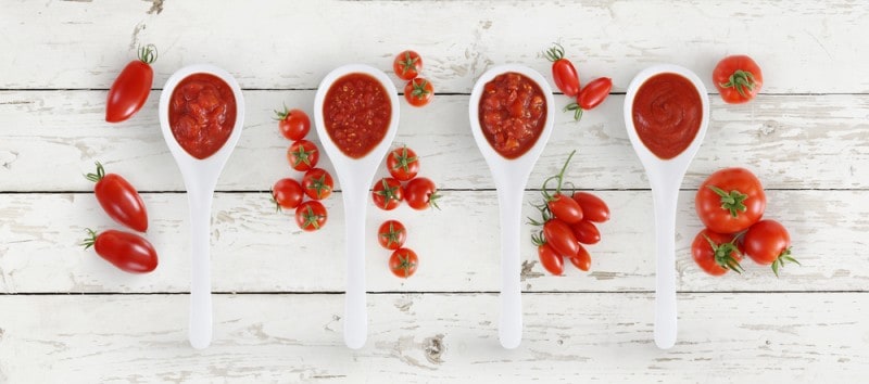 tomato sauce spoon with tomatoes
